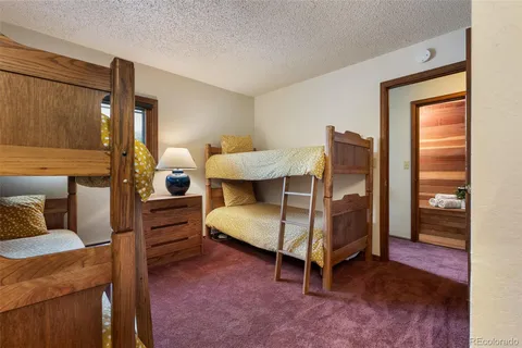 a bedroom with bed and window