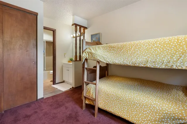 a bedroom with a bed and a table