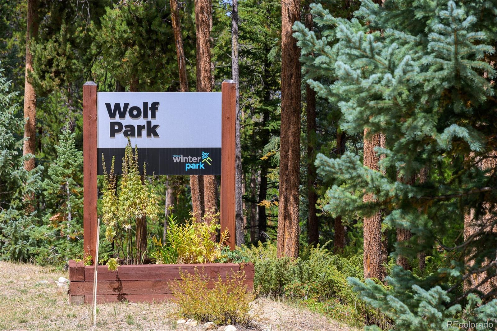 300 Kings Crossing Road, Unit B3 Winter Park, CO 80482 - Photo 33 of 38 an sign that is sitting in front of flowers