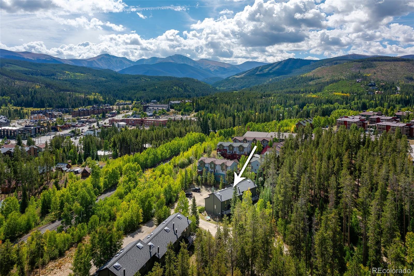 300 Kings Crossing Road, Unit B3 Winter Park, CO 80482 - Photo 36 of 38 a view of a city with lush green forest