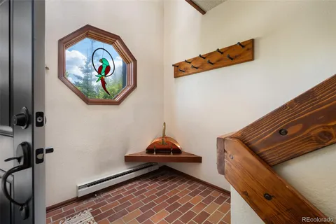 a bedroom with a bed and ceiling fan