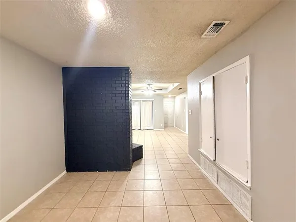 a view of a hallway to the house