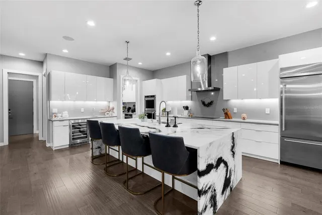 a kitchen with a cabinets and a book shelf
