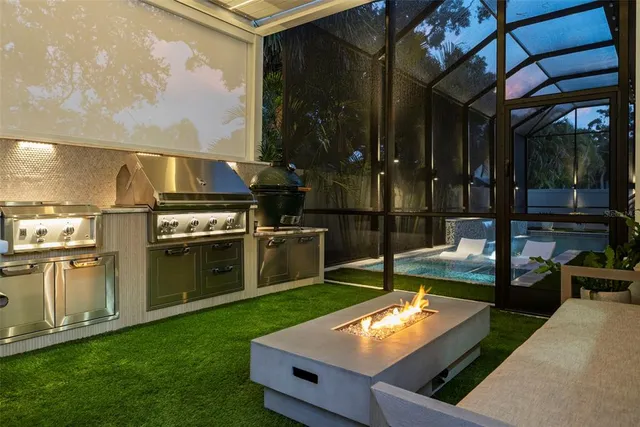 a living room with furniture a ceiling fan and a floor to ceiling window