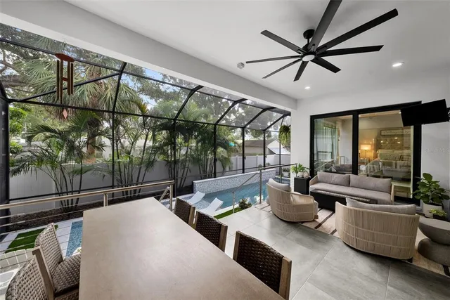 swimming pool view with a seating space