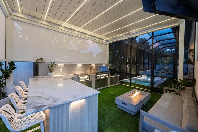 a front view of a house with a yard and outdoor seating