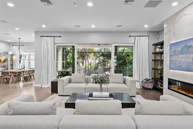 a kitchen with kitchen island granite countertop a sink a center island stainless steel appliances and cabinets