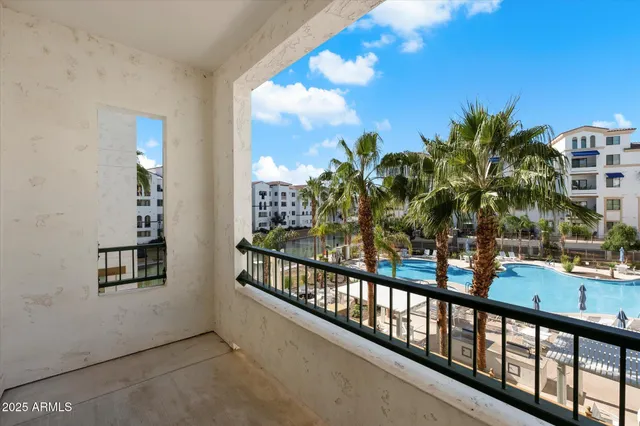 a view of a balcony with chairs