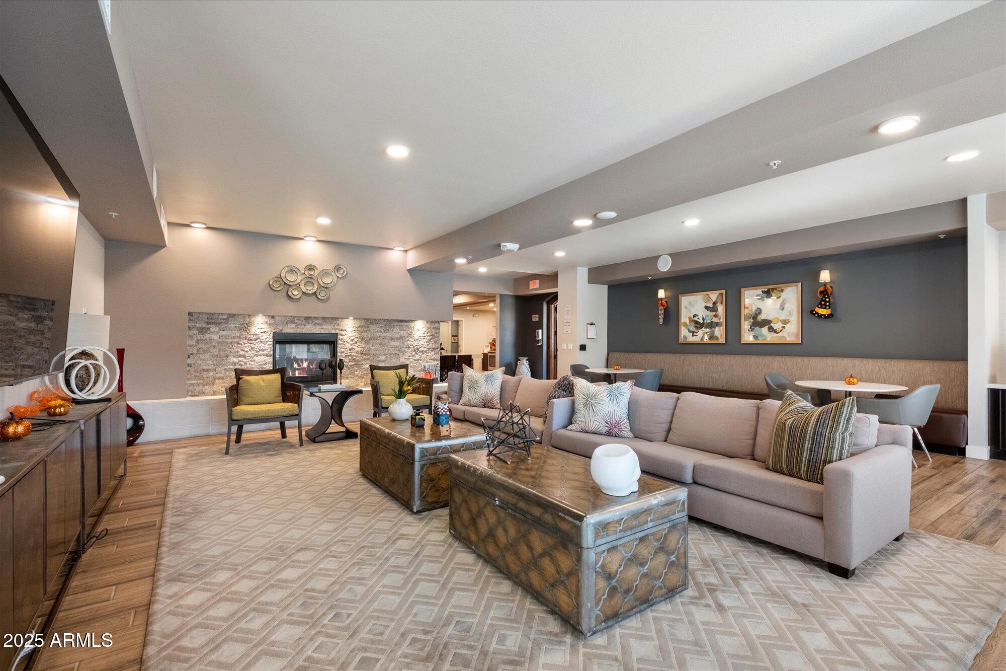 2511 West Queen Creek Road, Unit 230 Chandler, AZ 85248 - Photo 20 of 37 a living room with furniture and a flat screen tv