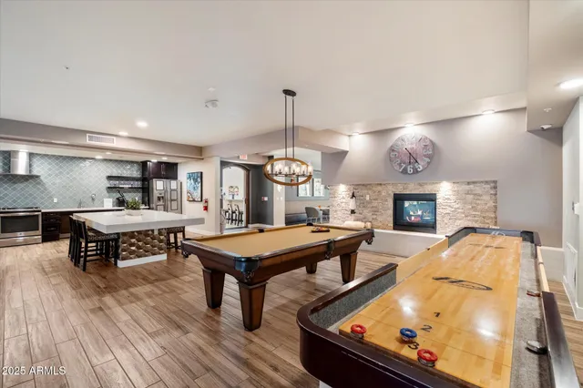 a dining room with furniture and wooden floor