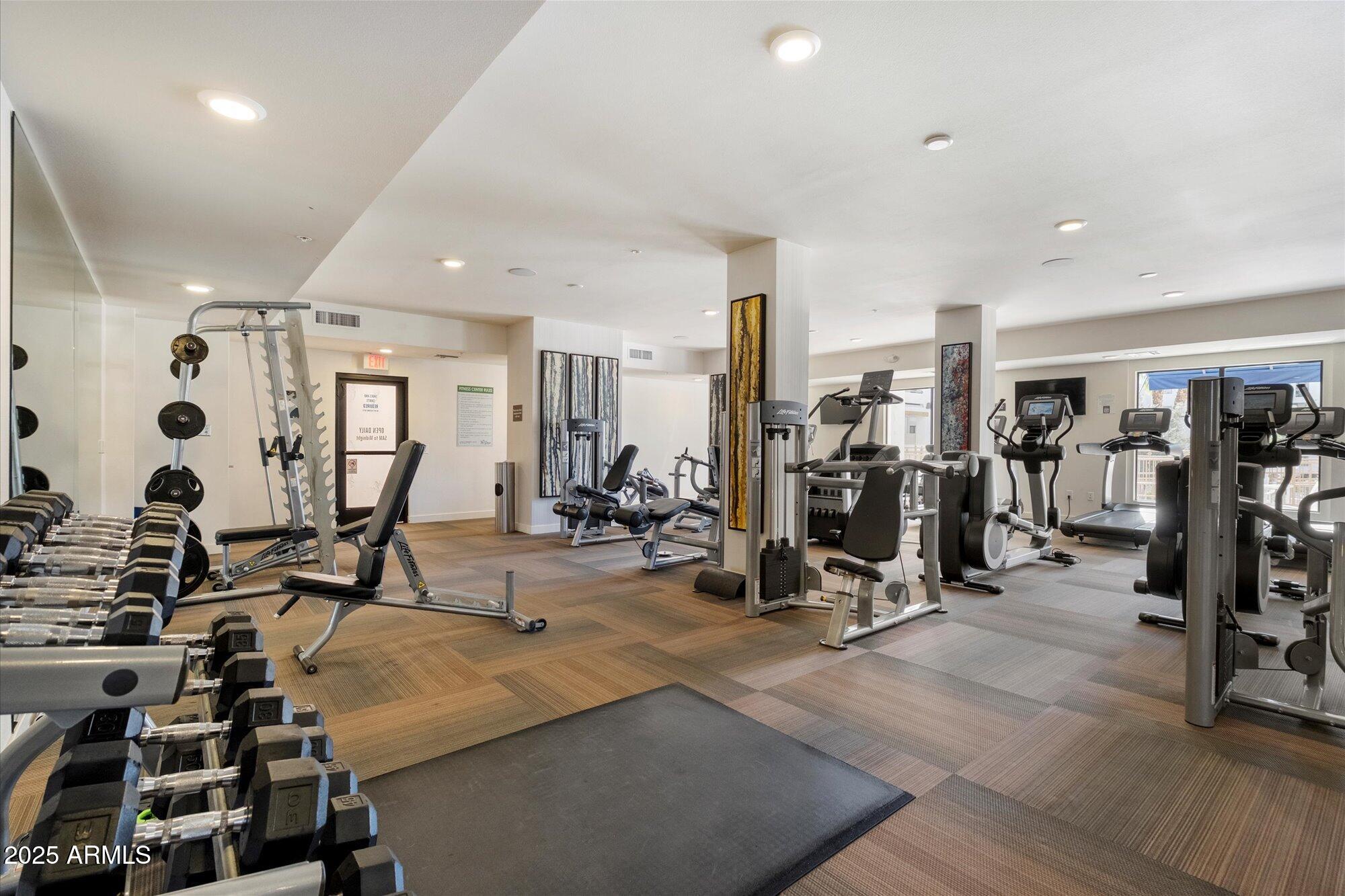 2511 West Queen Creek Road, Unit 230 Chandler, AZ 85248 - Photo 24 of 37 a view of a room with gym equipment