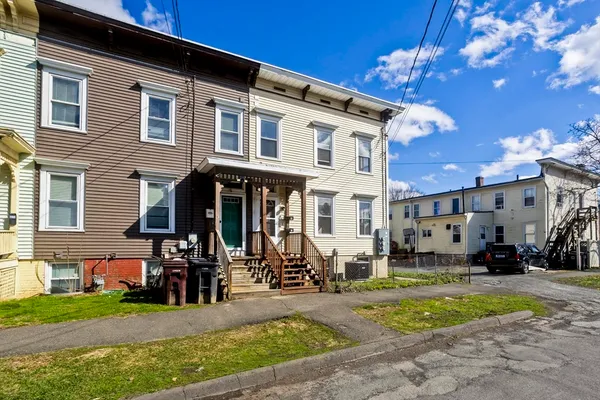 a view of a building with a yard