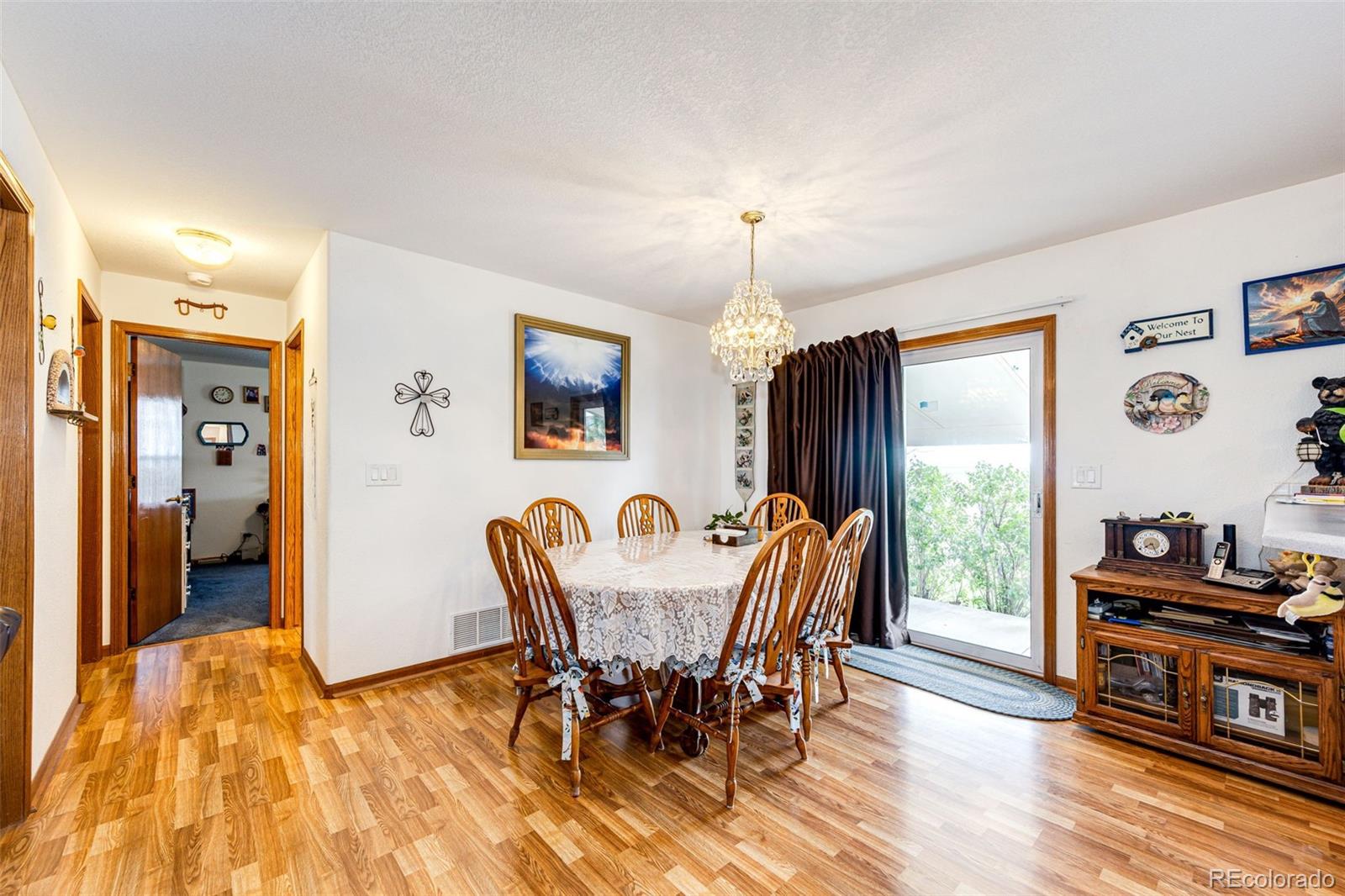 4420 Behrens Road Byers, CO 80103 - Photo 5 of 39 a view of a dining room with furniture window and wooden floor