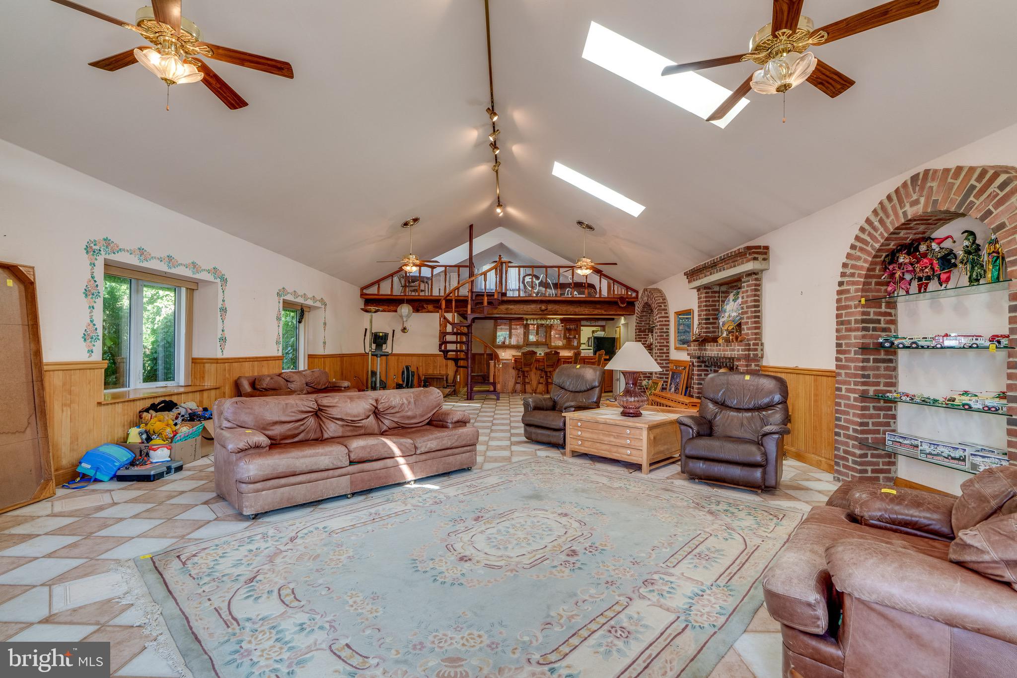 701 Bridge Valley Road Pequea, PA 17565 - Photo 45 of 91 a living room with furniture and a chandelier