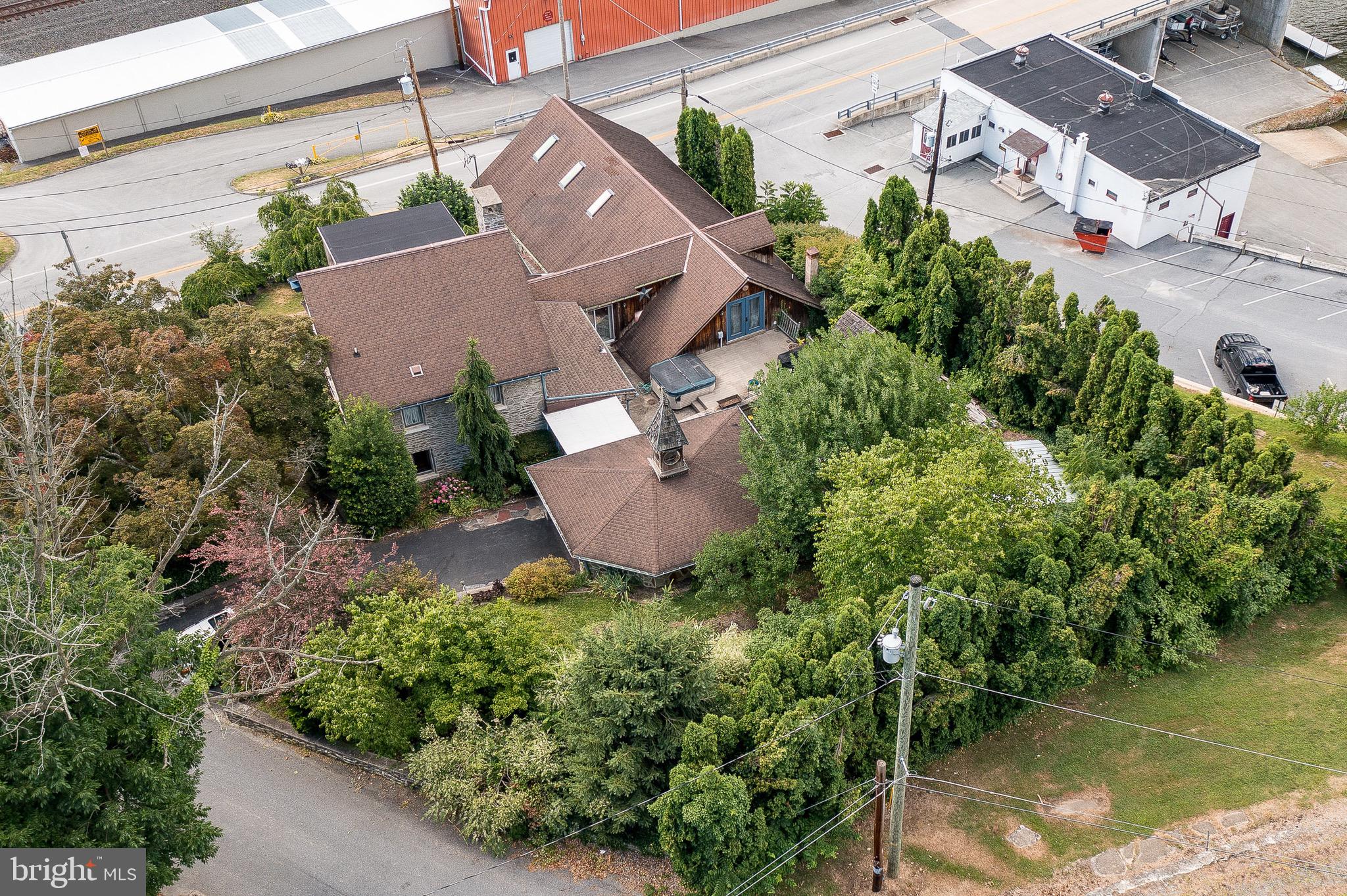 701 Bridge Valley Road Pequea, PA 17565 - Photo 65 of 91 an aerial view of a house with a garden and lake view