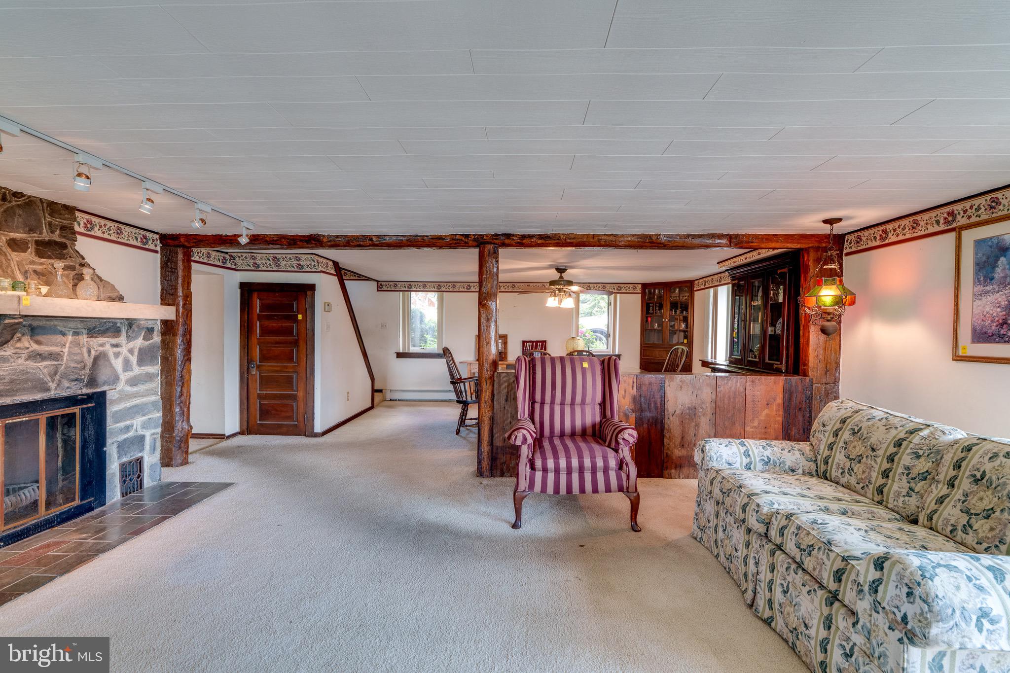 701 Bridge Valley Road Pequea, PA 17565 - Photo 8 of 91 a bedroom with furniture and a fireplace