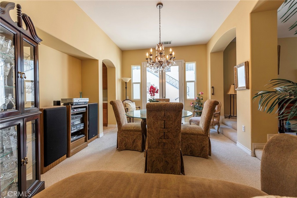10281 Hillside Road Rancho Cucamonga, CA 91737 - Photo 13 of 60 a view of a dining room with furniture window and outside view