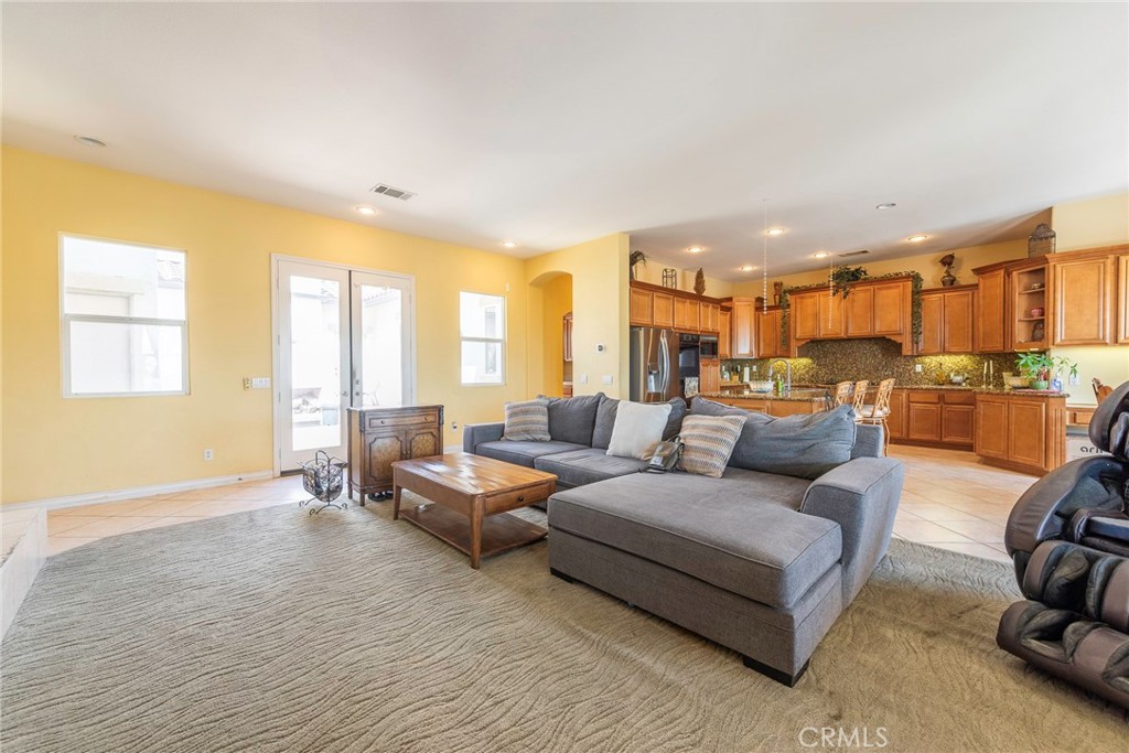 10281 Hillside Road Rancho Cucamonga, CA 91737 - Photo 23 of 60 a living room with furniture and a large window