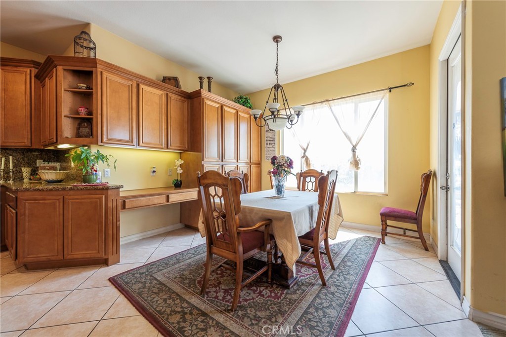 10281 Hillside Road Rancho Cucamonga, CA 91737 - Photo 28 of 60 a view of a dining room with furniture