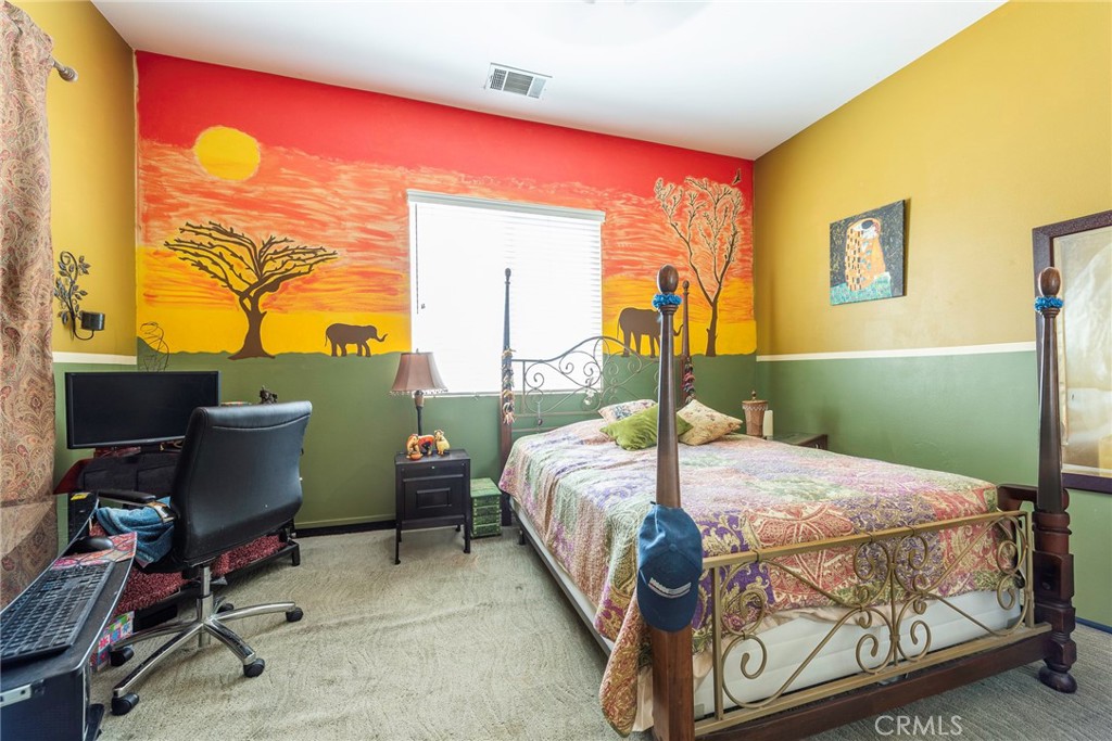 10281 Hillside Road Rancho Cucamonga, CA 91737 - Photo 29 of 60 a bed sitting in a room next to a window