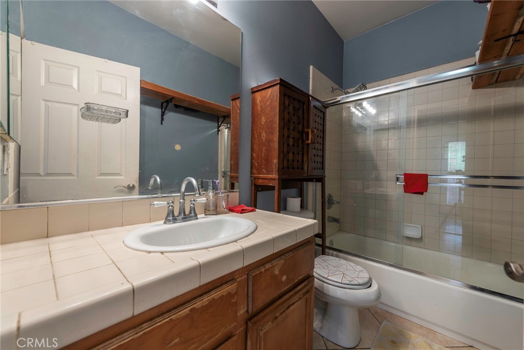 10281 Hillside Road Rancho Cucamonga, CA 91737 - Photo 49 of 60 a bathroom with a sink toilet and shower