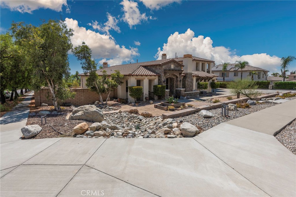 10281 Hillside Road Rancho Cucamonga, CA 91737 - Photo 5 of 60 a view of a house with a yard