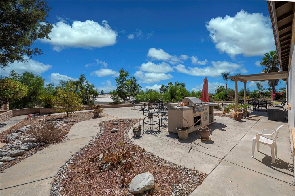 10281 Hillside Road Rancho Cucamonga, CA 91737 - Photo 57 of 60 a view of a backyard with sitting area