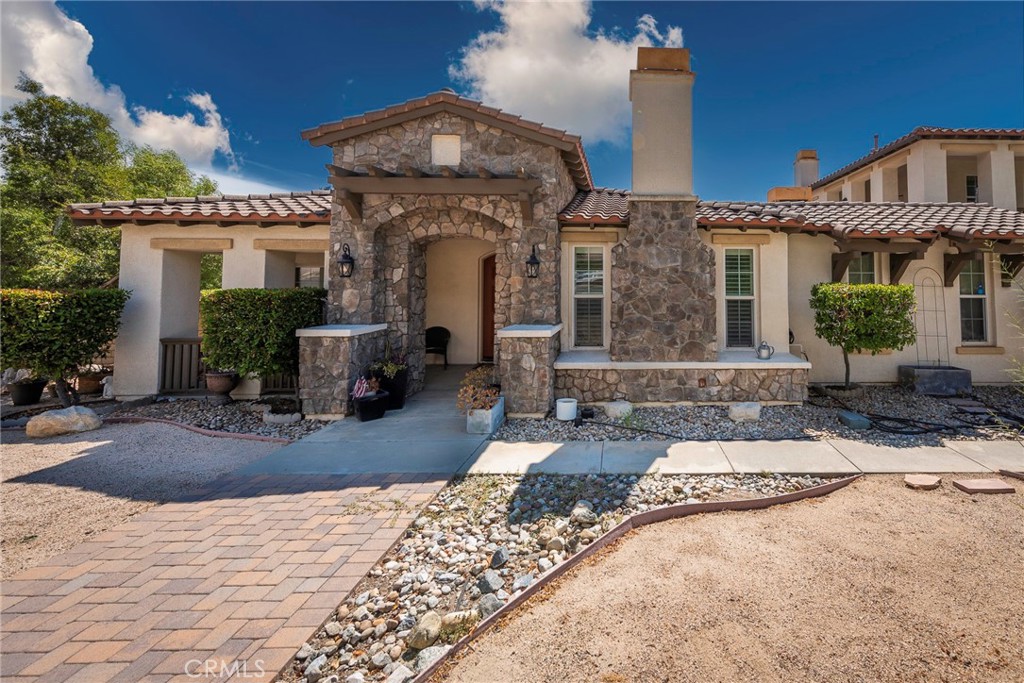 10281 Hillside Road Rancho Cucamonga, CA 91737 - Photo 7 of 60 a front view of a house with entertaining space