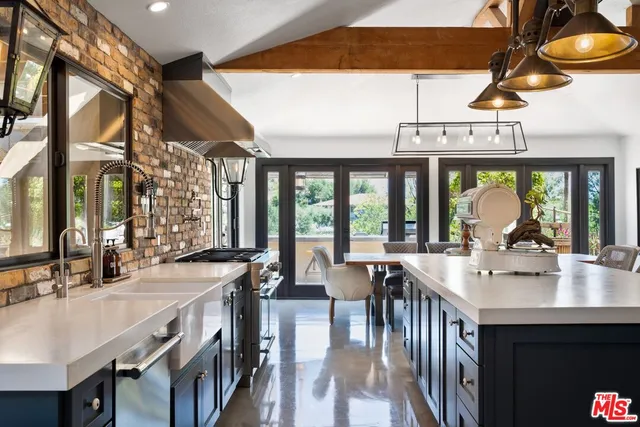 a view of a dining hall with furniture and chandelier
