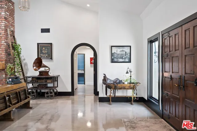 a bedroom with a bed and a table