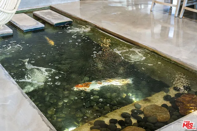 a view of house with outdoor sitting area