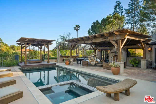 a living room with furniture a fireplace and a table
