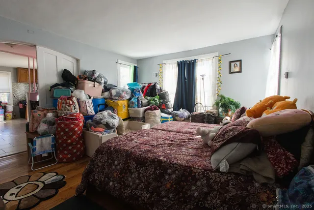 a bed room with a bed and a window