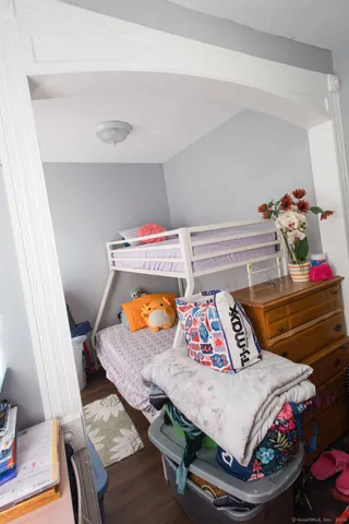 a bedroom with a bed and dresser