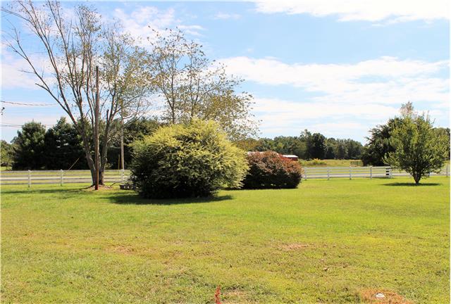 1077 Gnat Hill Road Manchester, TN 37355 - Photo 4 of 20 Corner lot w/ a side view of property vinyl white fence*