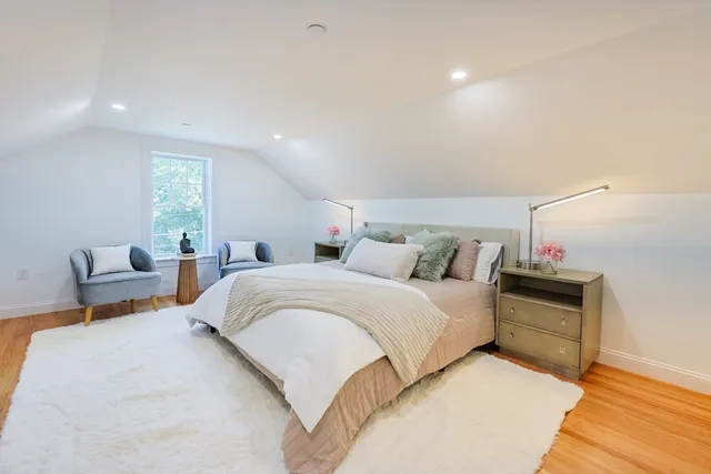 a bedroom with bed and window