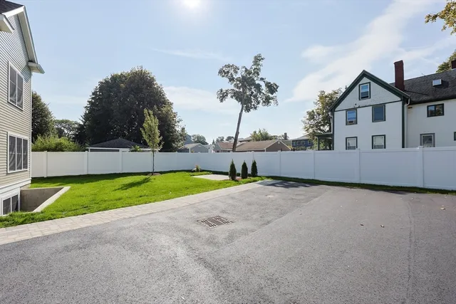 a view of backyard with a garden and entertaining space