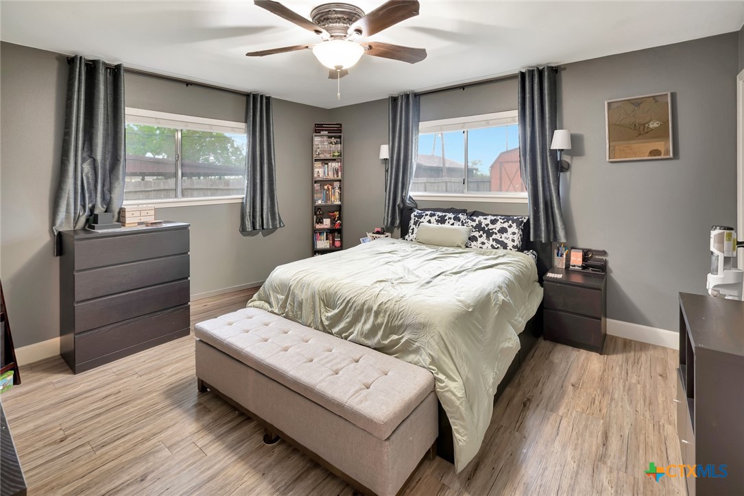 401 Viking Street Victoria, TX 77905 - Photo 12 of 20 a bedroom with a large bed and a large window