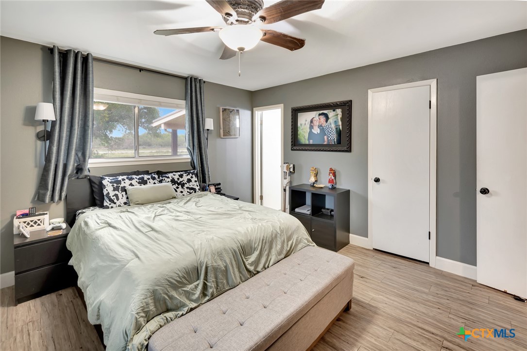 401 Viking Street Victoria, TX 77905 - Photo 13 of 20 a bedroom with a large bed and a large window