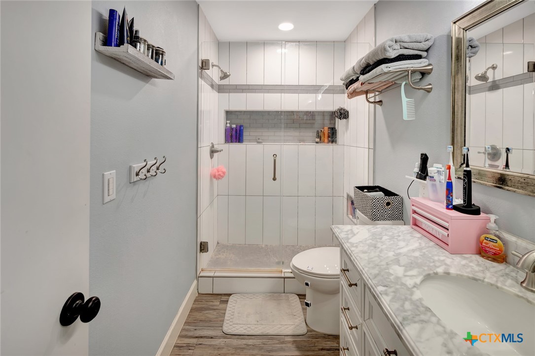 401 Viking Street Victoria, TX 77905 - Photo 14 of 20 a bathroom with a sink toilet and shower