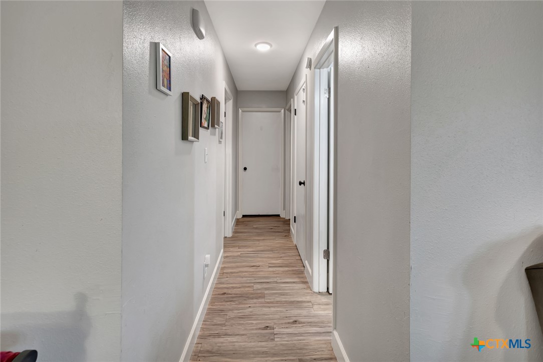 401 Viking Street Victoria, TX 77905 - Photo 5 of 20 a view of a hallway with wooden floor