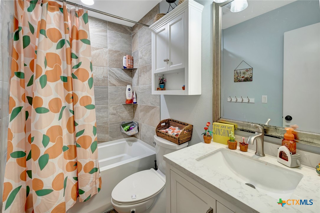 401 Viking Street Victoria, TX 77905 - Photo 8 of 20 a bathroom with a sink toilet and shower
