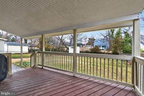 a view of a balcony with wooden floor