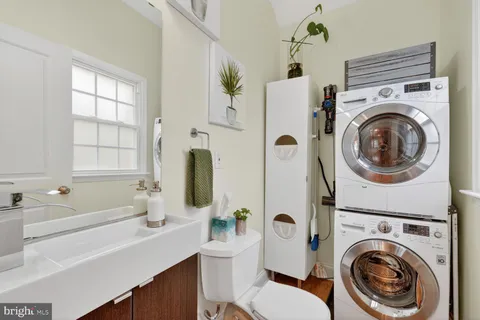 a bathroom with a sink a mirror and a bathtub