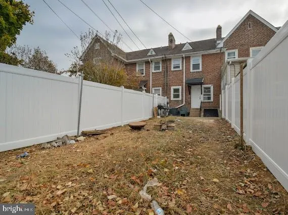 a front view of a house with many windows