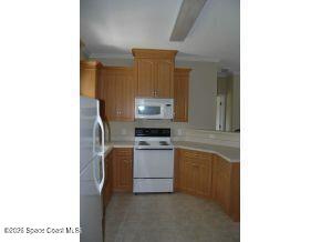 1130 Grapefruit Road Southeast Palm Bay, FL 32909 - Photo 2 of 4 Kitchen 1130 SE Palm Bay - Copy