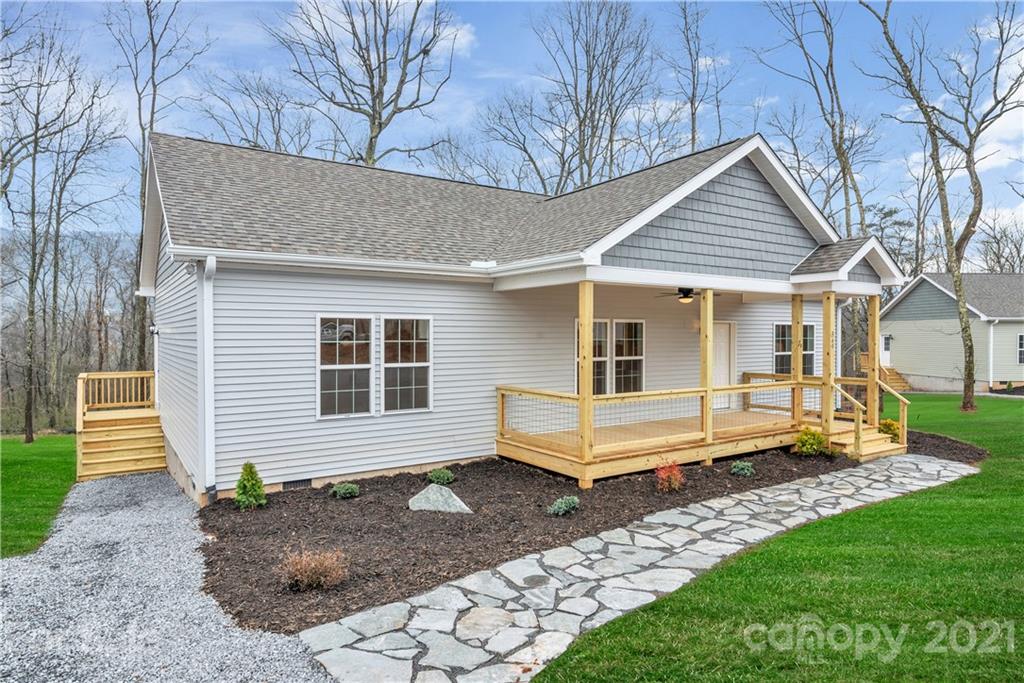 349 Ridge View Drive, Unit 3 Clyde, NC 28721 - Photo 3 of 20 a front view of a house with a yard