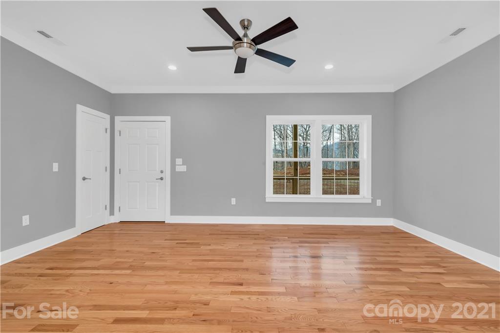 349 Ridge View Drive, Unit 3 Clyde, NC 28721 - Photo 4 of 20 a view of an empty room with a window