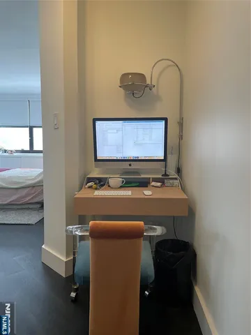 a view of a room with a table and chairs