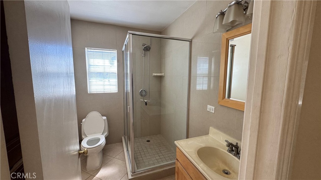911 Genoa Street, Unit A Monrovia, CA 91016 - Photo 7 of 9 a bathroom with a sink toilet and shower